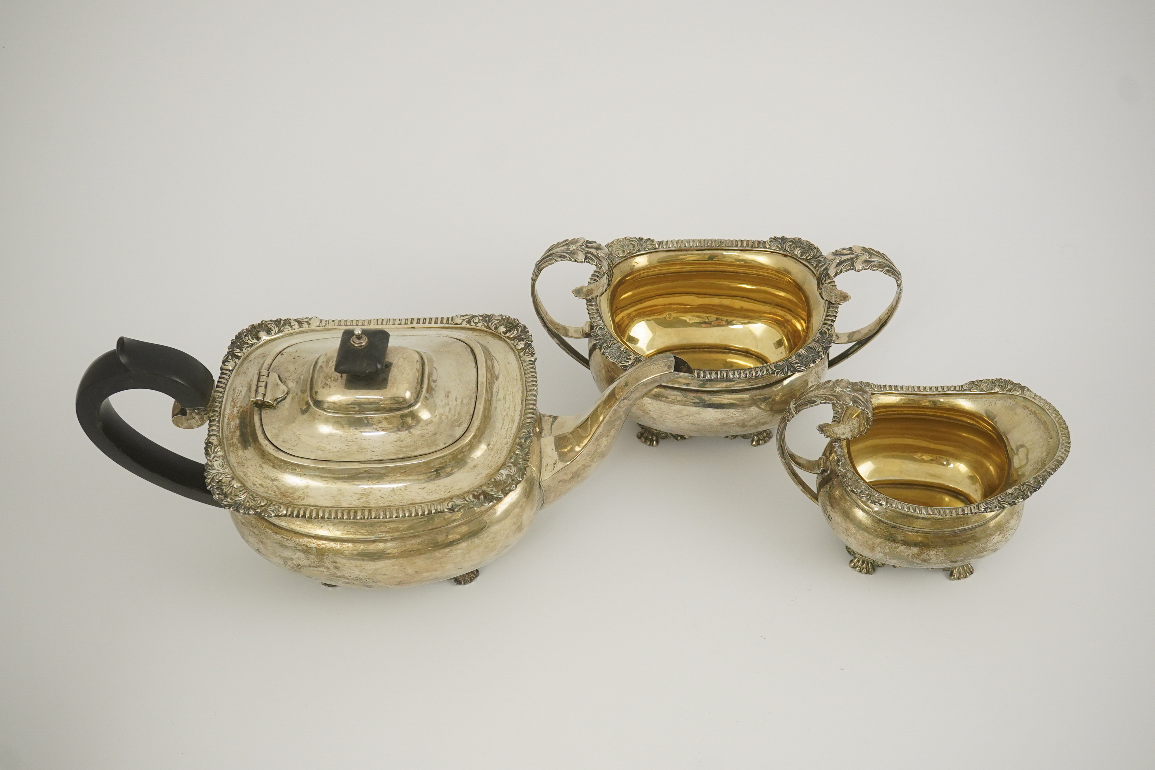 A George V silver three piece tea set by Edward Barnard & Sons Ltd